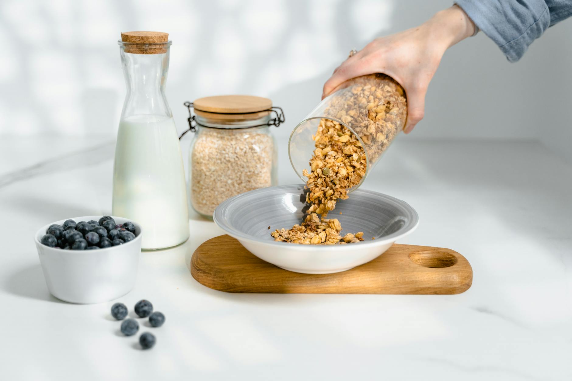 Oat milk being poured into a glass
