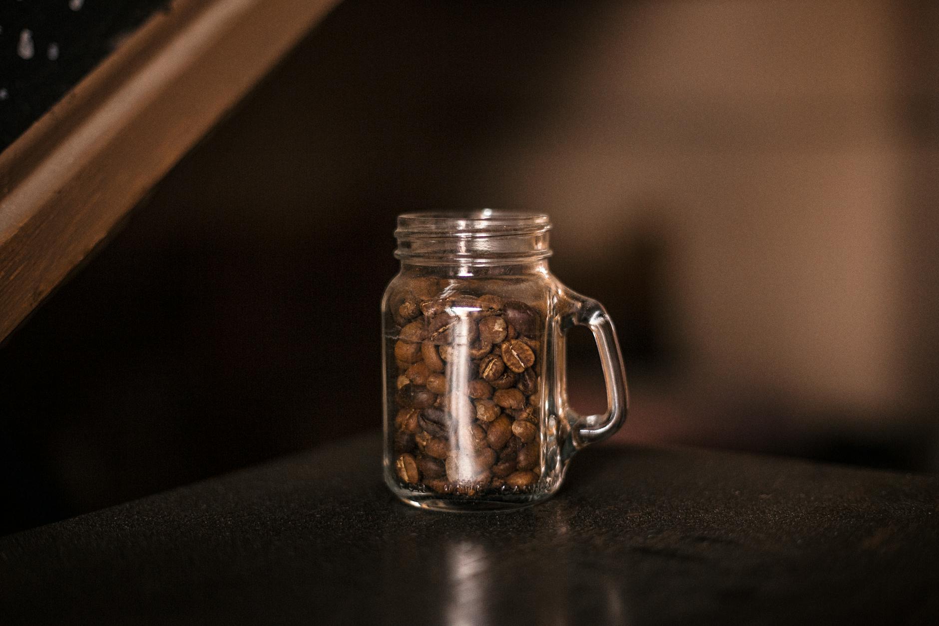 A cup of tea and a cup of coffee placed side by side for comparison