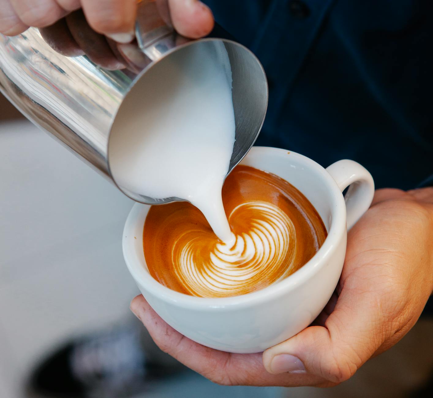 Milk being frothed for a homemade chai latte