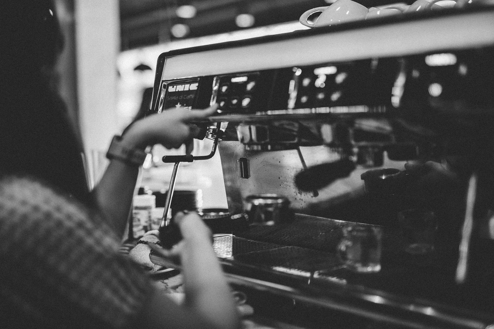 Espresso machine pulling a fresh shot into a glass