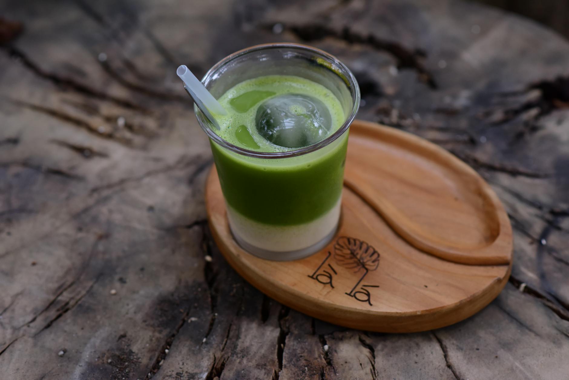A matcha latte and a chai latte placed side by side